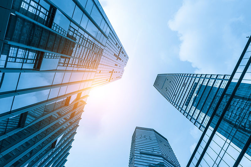 looking up at skyscrapers